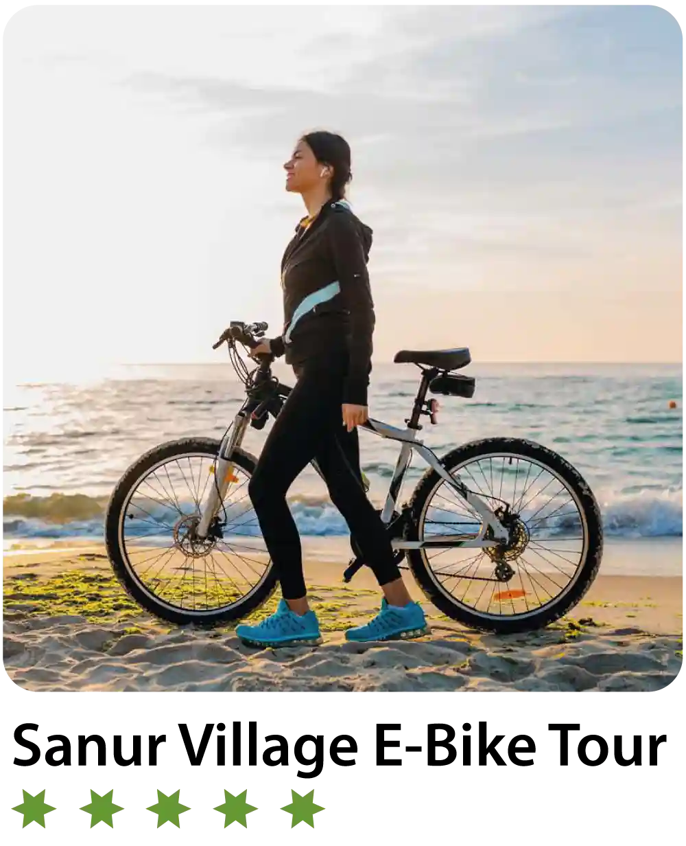 a woman walking with a bicycle on a beach